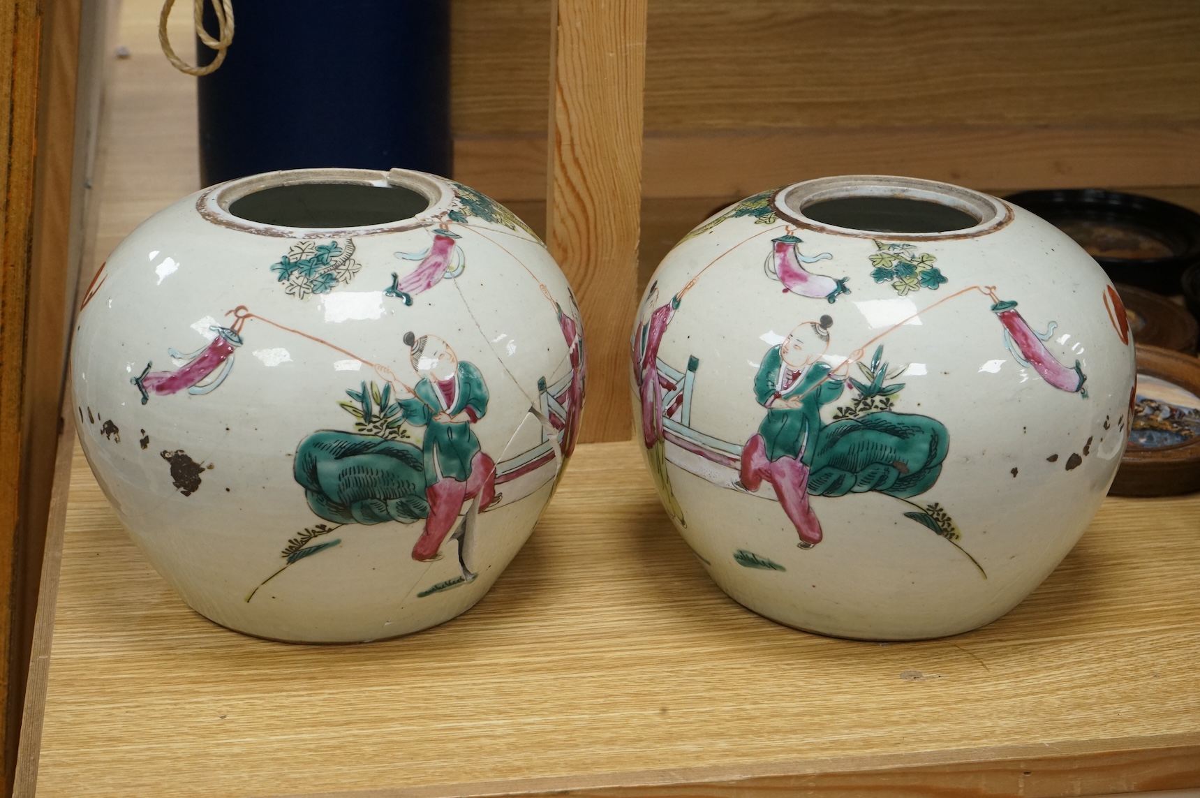 A pair of late 19th century Chinese famille rose jars, without covers, 19cm high.